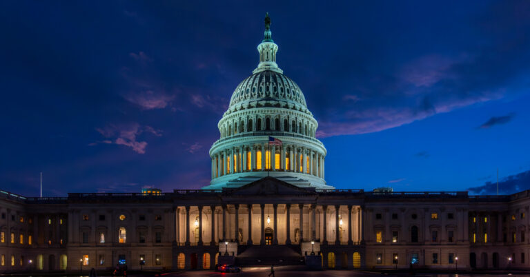 Nighttime image of US Capitol Building.